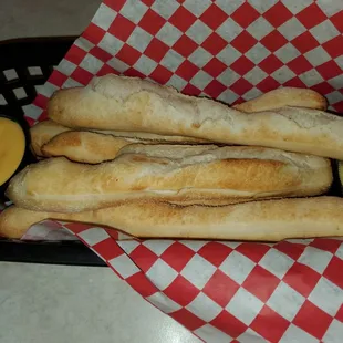 Single order of breadsticks with cheese sauce and garlic butter
