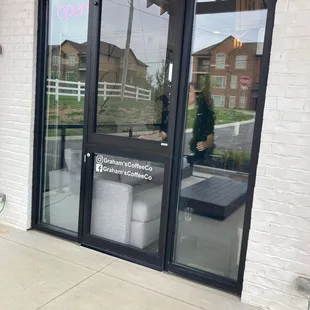 the entrance to a coffee shop