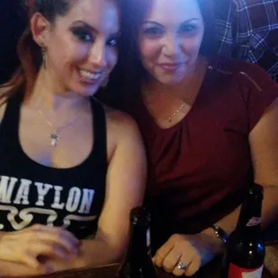 two women sitting at a bar