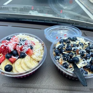 two bowls of fruit and yogurt