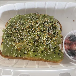 avocado toast in a styrofoam container