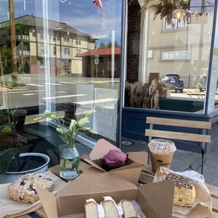 a table with pastries and cakes