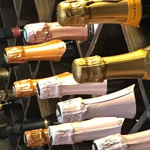 a row of bottles of champagne