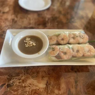 Soft shrimp and pork spring rolls served with peanut sauce