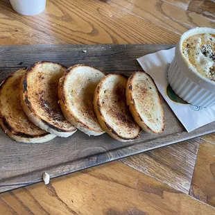 a plate of bread and a cup of coffee