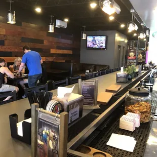 customers at the counter of a restaurant