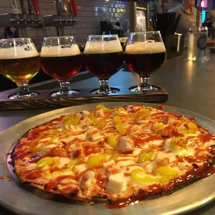 Buffalo chicken pizza and a flight of beer!