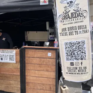 a man behind a booth