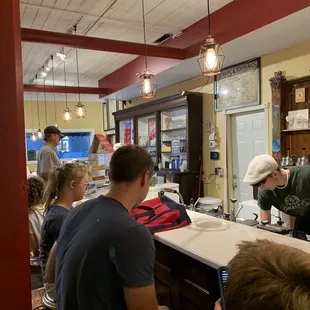 a group of people at a counter