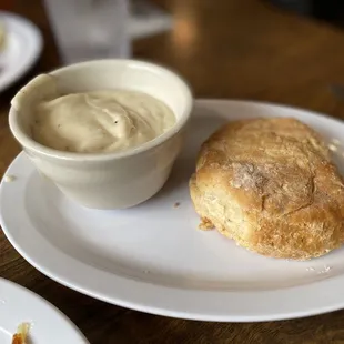 a biscuit and a bowl of cream