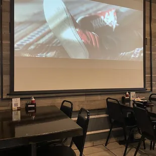 Large screen showing K-Pop videos