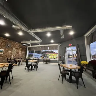 a dining area with tables and chairs