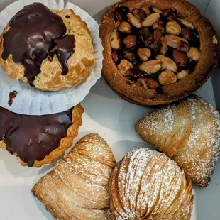 Chocolate bombolone, Mixed nuts apricot tart, Sfogliatella.