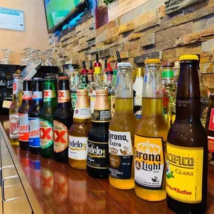 bottles of beer on a bar