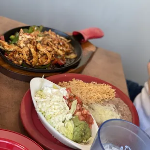 a plate of food and a glass of water