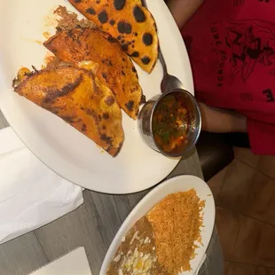 Quesa birria tacos with refried beans and rice