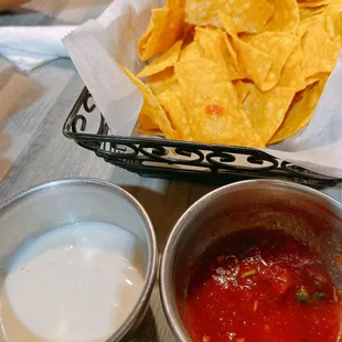 Complimentary chips, salsa &amp; white sauce (not cheese, tasted like a  creamy salad dressing)