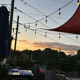 Rooftop seating at sunset.