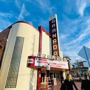 people walking in front of it