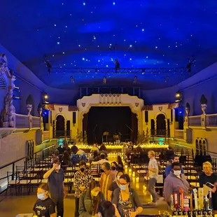 a crowd of people sitting at tables