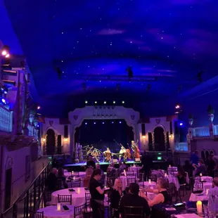 a view of the stage from the back of the room