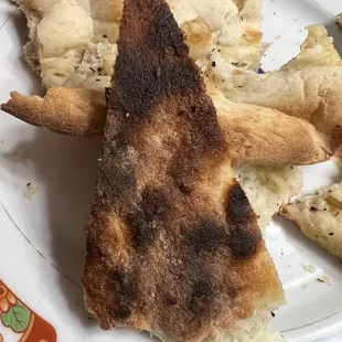 Whole bottom was burnt. It didn't look or taste like pizza