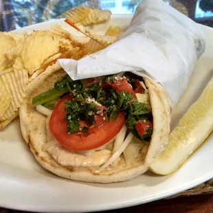Hummus wrap topped with tabbouleh