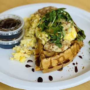 Half waffle with scrambled eggs, balsamic glaze and arugula