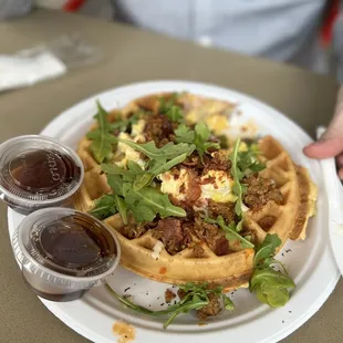a person holding a plate of food