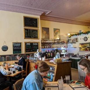 diners at tables with menus