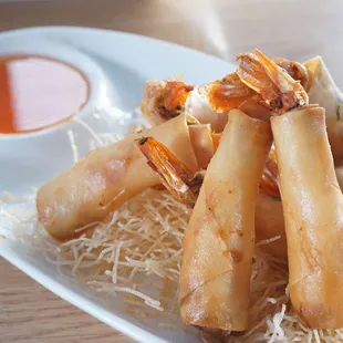 1: Shrimp Blankets | 
Fried shrimp egg rolls served with sweet and sour sauce
