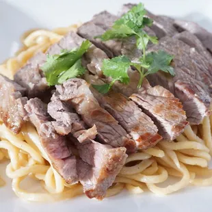 S1: Garlic Steak Noodles | 
Stir fried garlic egg noodles topped with steak and parmesan cheese