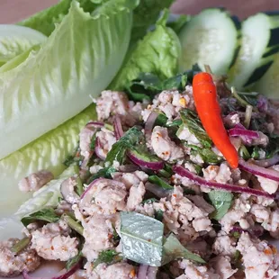 16: Larb 
| Your choice of ground chicken, beef, or pork mixed with onion, mint, cilantro, lime juice, and groud roasted rice