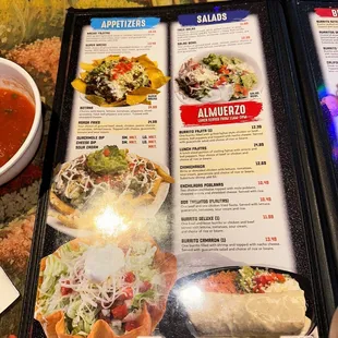 a menu and a bowl of soup