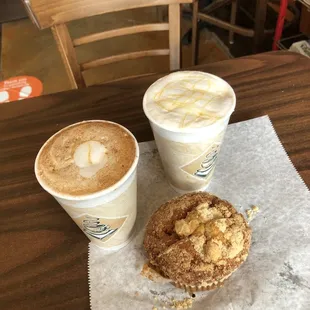 two cups of coffee and a doughnut