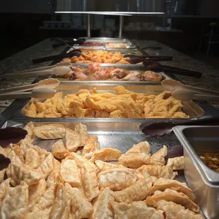 a variety of food items on a buffet