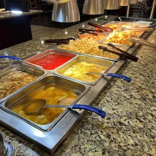 a variety of food in a buffet