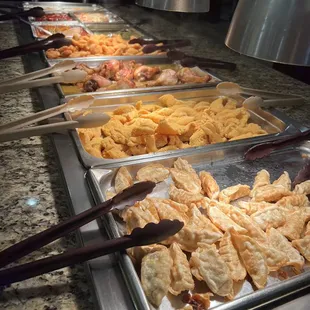 a variety of food items in a buffet
