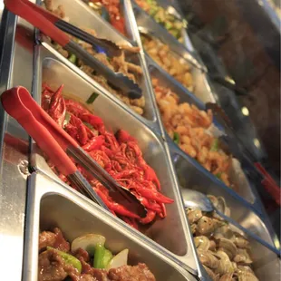 a variety of food items in a buffet