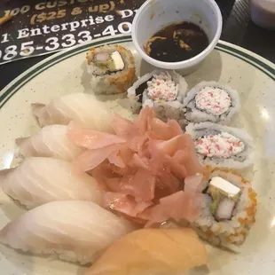 a plate of sushi and sauces