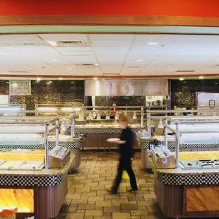 a man walking through a buffet