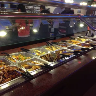 a variety of food in a buffet