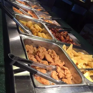 a variety of food items in a buffet