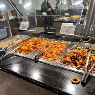 a variety of food items in a buffet