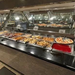 a variety of food in a buffet