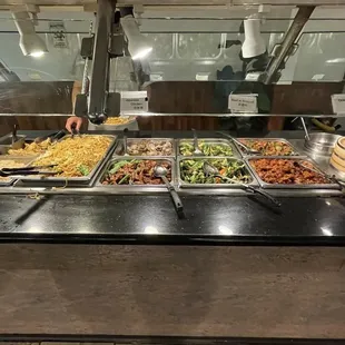 a buffet with a variety of food items