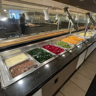 a buffet with a variety of food items