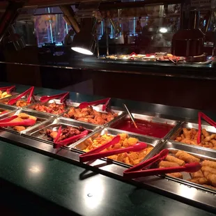 a variety of food items in a buffet