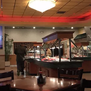 a man standing in front of a buffet