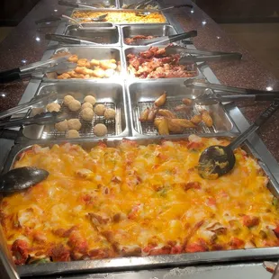 a buffet full of different types of food